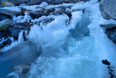 Melting ice from the Khumbu glacier runs down the mountain at Everest Base Camp, Nepal in the Ganges-Bramaputra water tower. The region is expected to see a 1.6 degree C temperature rise by 2050. New research supported by National Geographic and Rolex’s Perpetual Planet partnership highlights the importance and vulnerability of the world’s glacier-based water systems. Learn more at natgeo.com/PerpetualPlanet. Photo Credit: Brittany Mumma, National Geographic. 