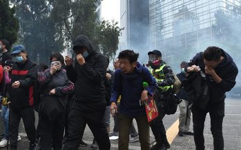 Police arrest organiser of Hong Kong protest after rally turns violent