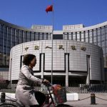 Asian shares stumble, oil surges after US air strikes in Iraq