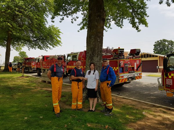 Helen Feng, owner Alliance Pharmacy - Tallangatta, with local CFA crew