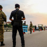 Man arrested for ramming through police roadblock