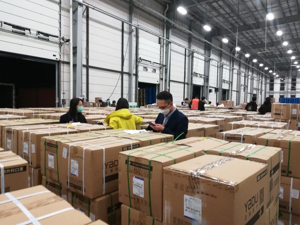 In a Tmall Supermarket warehouse in Zhejiang Province, China, Alibaba.com representatives inspect goods ordered by overseas buyers In a Tmall Supermarket warehouse in Zhejiang Province, China, Alibaba.com representatives inspect goods ordered by overseas buyers