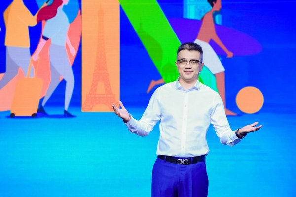 Trip.com Group CMO Bo Sun (pictured) announces the promotion at the company's "Travel On" launch event. Trip.com Group CMO Bo Sun (pictured) announces the promotion at the company's "Travel On" launch event.