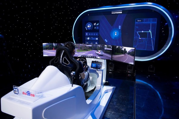 A remote human operator demonstrates the 5G Remote Driving Service, which allows instantaneous human intervention in case of extraordinary emergencies. A remote human operator demonstrates the 5G Remote Driving Service, which allows instantaneous human intervention in case of extraordinary emergencies.