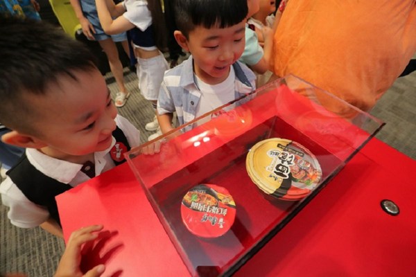 Photo shows Master Kong displaying the space instant noodle products.