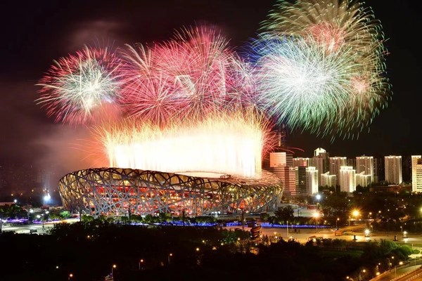 Photo shows fireworks explode over the National Stadium. (Photo by Xinhua News Agency) Photo shows fireworks explode over the National Stadium. (Photo by Xinhua News Agency)