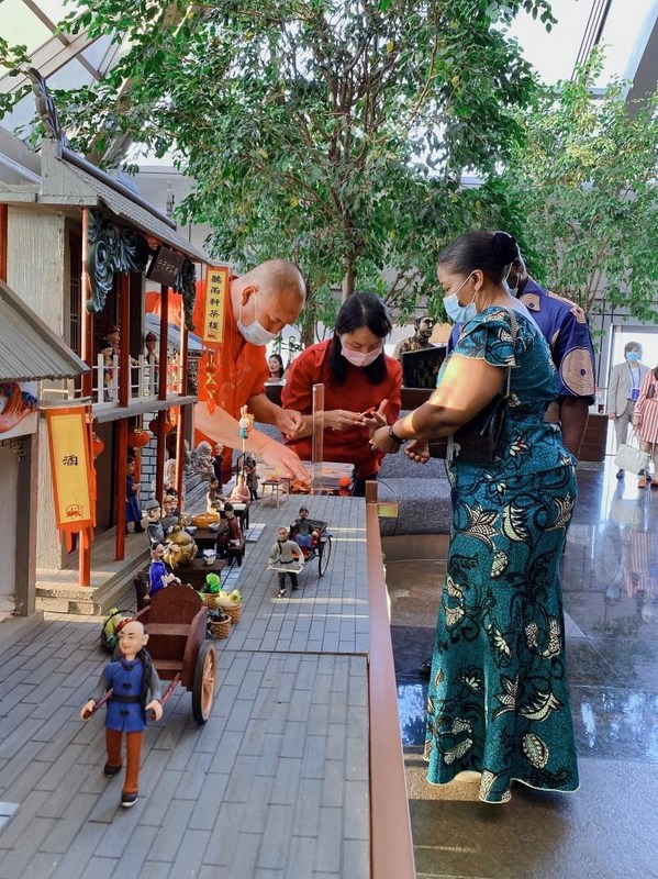 Third Secretary of Zimbabwe and his family making dough figures, a traditional Chinese art form. Third Secretary of Zimbabwe and his family making dough figures, a traditional Chinese art form.