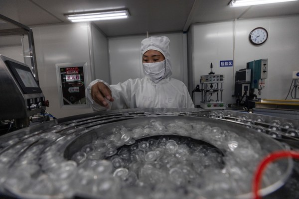 A woman works in a Suyun factory for medical supplies. A woman works in a Suyun factory for medical supplies.