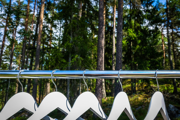 Clothes hanger / closet in the woods / forest. Concept for organic clothes, eco-friendly, ecological fashion.