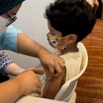 Covid: Khairy shares relief after youngest son receives first Covid vaccination shot