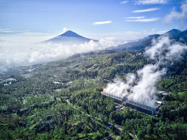 A beautiful view of the Star Energy Geothermal power plant operating at an altitude of 1,800m above sea level among dense forests in Mount Darajat with a harmonious backdrop of Mount Cikuray and Mount Papandayan in Garut Regency, West Java.