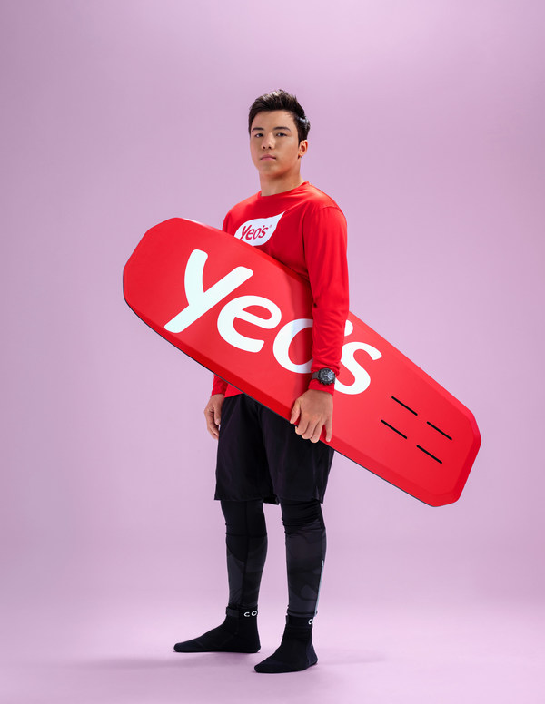 World Kitefoiling Champion Maximilian Maeder posing with Yeo's kiteboard