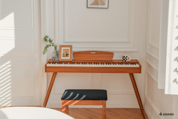The stylish, vintage-design DDP80 digital piano recreates the sound of an acoustic grand piano. Picture provided by Donnermusic.
