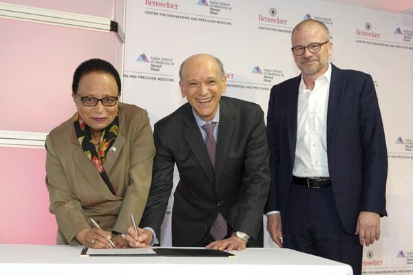 President of Rensselaer Polytechnic Institute, Dr. Shirley Ann Jackson, Dr. Eric Nestler, Icahn School of Medicine at Mount Sinai and NYCEDC President Andrew Kimball sign a ceremonial agreement at the launch of the Center for Engineering and Precision Medicine on Thursday, May 12, 2022 in New York. The new center is a partnership between Rensselaer Polytechnic Institute and the Icahn School of Medicine at Mount Sinai.