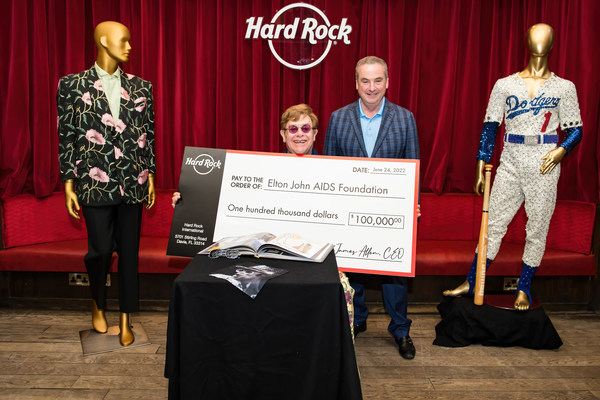 Hard Rock International presents Elton John with check for Elton John AIDS Foundation at London Hard Rock Cafe. Photo Credit: BEN GIBSON PHOTO Hard Rock International presents Elton John with check for Elton John AIDS Foundation at London Hard Rock Cafe. Photo Credit: BEN GIBSON PHOTO