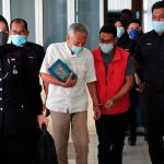 Former diplomat, son charged with growing 102 cannabis trees