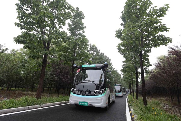 The autonomous bus fleet driving in the mountain park in the Zibo National New & Hi-tech Industrial Development Zone