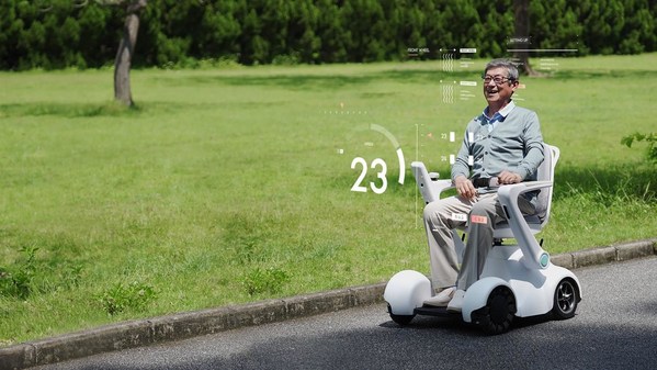 A resident of a senior-care facility is experiencing the “barrier-free” travelling mobility service in a park, provided by UBTECH Smart Wheelchair Robot-PathFynder