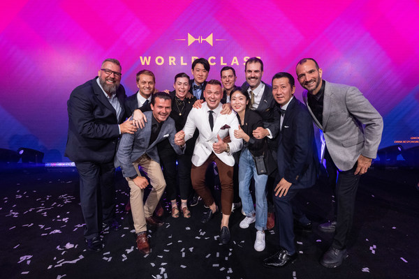 Adrián Michalčík, representing Norway, is awarded the title of world’s best bartender at the Diageo World Class Global Bartender of the Year competition 2022- surrounded by members of the World Class Hall of Fame