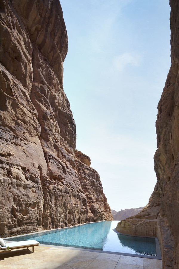 A tranquil rock pool with views of the expansive valley A tranquil rock pool with views of the expansive valley