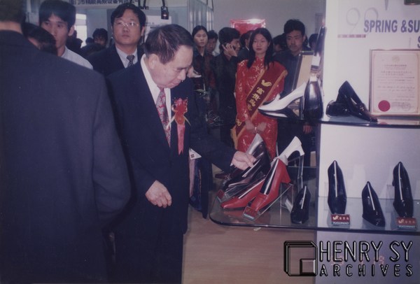 Mr. Sy at a footwear exposition in Jinjiang in 1999 Mr. Sy at a footwear exposition in Jinjiang in 1999