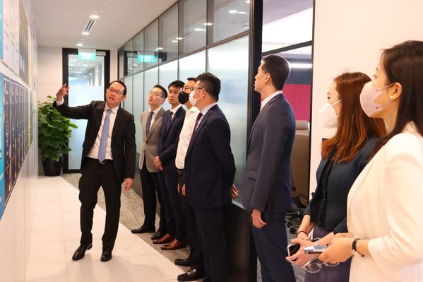 CGS-CIMB Deputy CEO Malcolm Koo leading a tour of the Singapore corporate office.