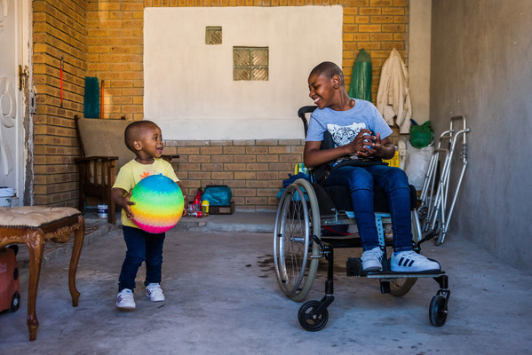 “Two children play after a wheelchair fitting at Shonaquip Social Enterprises in Cape Town, South Africa. The Clinton Health Access Initiative (CHAI) is working to ensure that the right assistive technology, including wheelchairs, hearing aids and glasses, is available, accessible, and fitted specially to the needs of the individual child, no matter where they live.” Photo Credit: Shonaquip Social Enterprises (Photo credit: Amy Montalvo, One Pass Productions)