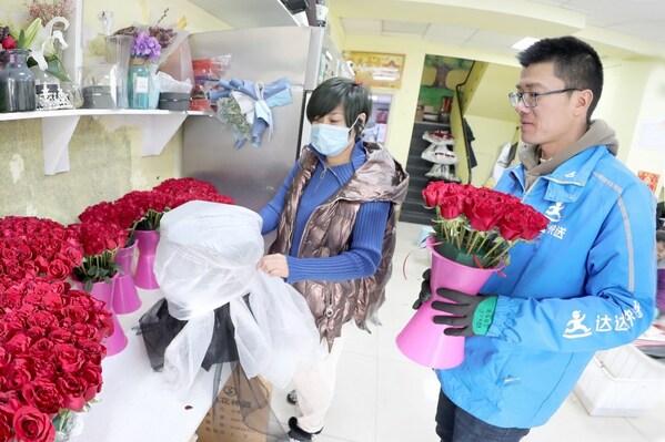 Dada Now rider waited to pick up a flower bouquet for on-demand delivery