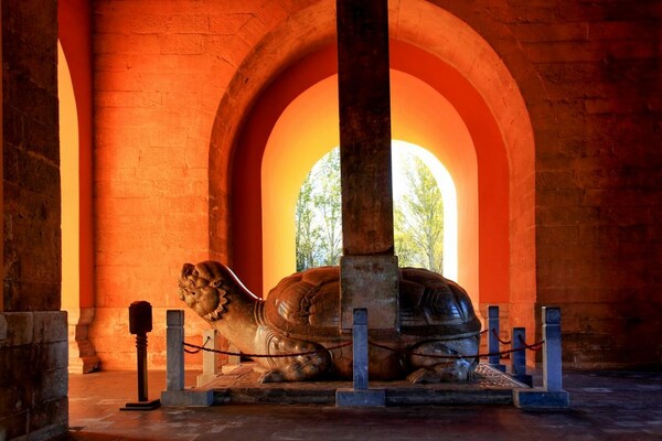 Divine Merit Stele in golden evening sunlight Divine Merit Stele in golden evening sunlight