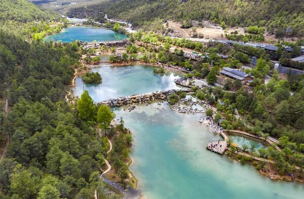 This aerial photo taken on May 17, 2023 shows the summer scenery of Lanyue (Blue Moon) Valley in Lijiang, southwest China's Yunnan Province. (Xinhua/Chen Xinbo) This aerial photo taken on May 17, 2023 shows the summer scenery of Lanyue (Blue Moon) Valley in Lijiang, southwest China's Yunnan Province. (Xinhua/Chen Xinbo)