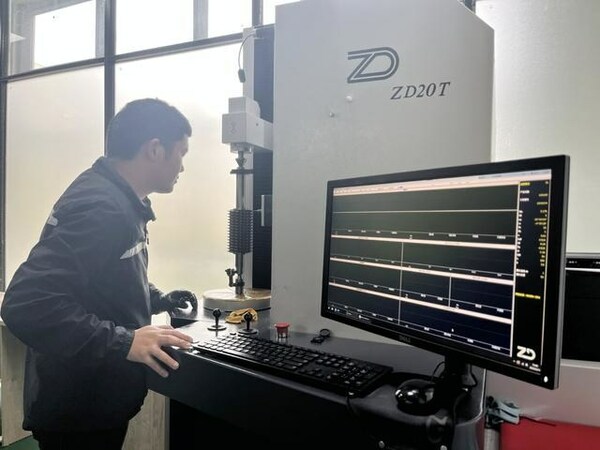 A worker of Guizhou Anxin Numerical Control Technology Co., Ltd. is operating a device. A worker of Guizhou Anxin Numerical Control Technology Co., Ltd. is operating a device.