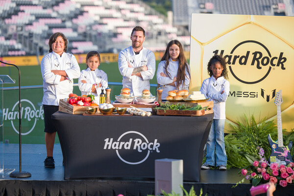 Hard Rock International and global brand ambassador, Leo Messi, announce their first-ever Messi menu for kids, “The Hard Rock Messi Kids Menu,” with help from Seminole Tribe of Florida and local South Florida community kids during the launch event at DRV PNK Stadium on October 2. (AJ Shorter / Hard Rock International) Hard Rock International and global brand ambassador, Leo Messi, announce their first-ever Messi menu for kids, “The Hard Rock Messi Kids Menu,” with help from Seminole Tribe of Florida and local South Florida community kids during the launch event at DRV PNK Stadium on October 2. (AJ Shorter / Hard Rock International)