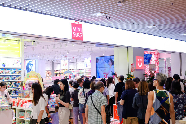 Customers exploring the treasure hunt shopping experience at MINISO's TKO Plaza new store