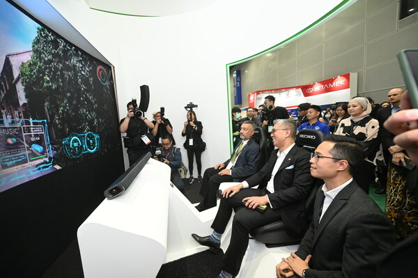 The MITI minister Tengku Zafrul and Maxis Chairman Tan Sri Mokhzani Mahathir at E-Mobility Asia (2023) Exhibition at Kuala Lumpur Convention Centre.