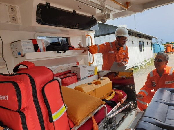 Global Health Assistance Staff checking equipment in an ambulance before deployment Global Health Assistance Staff checking equipment in an ambulance before deployment