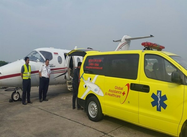 A Global Assistance and Healthcare ambulance together with an aircraft which is used to evacuate patients A Global Assistance and Healthcare ambulance together with an aircraft which is used to evacuate patients