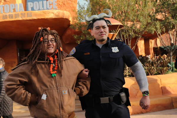 First official guests to Zootopia enter the new land, donning Zootopia-inspired looks