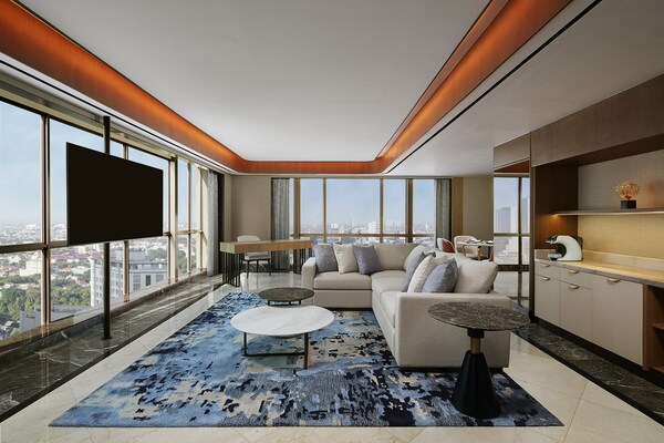 The Royal Suite features refurbished interiors, a spacious living area, 360-degree views, and a generously sized private balcony accessible throughout your stay.