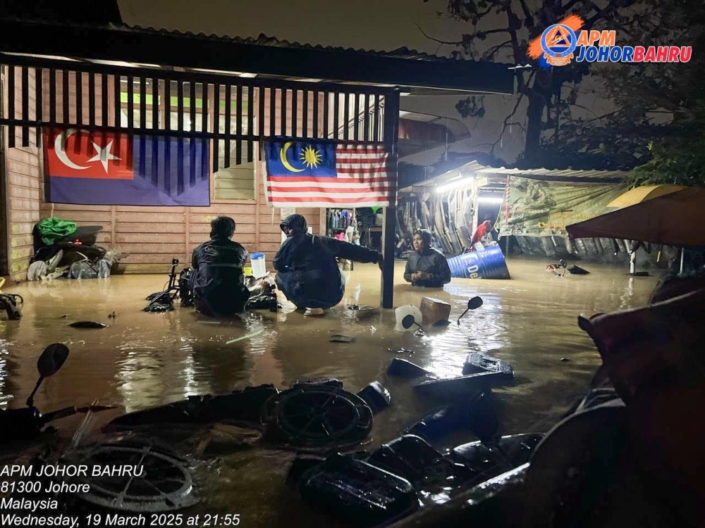 Water levels surge, evacuations ongoing in flooded Johor