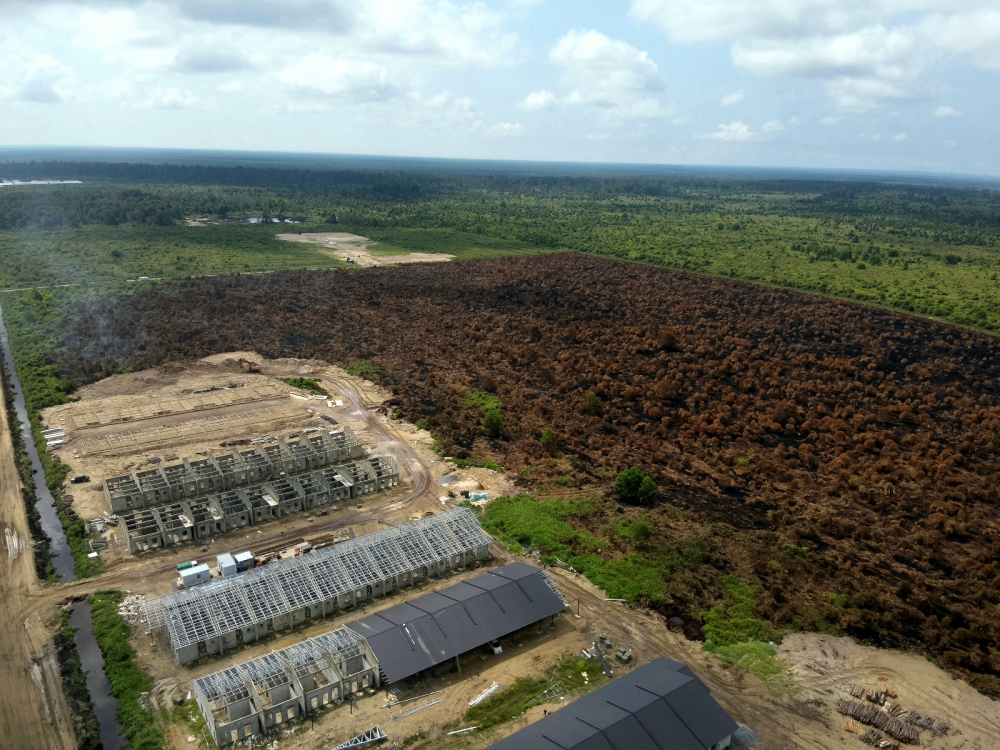 Mukah forest fire near UiTM scorches over 100ha, helicopter water bombs hotspots after two weeks