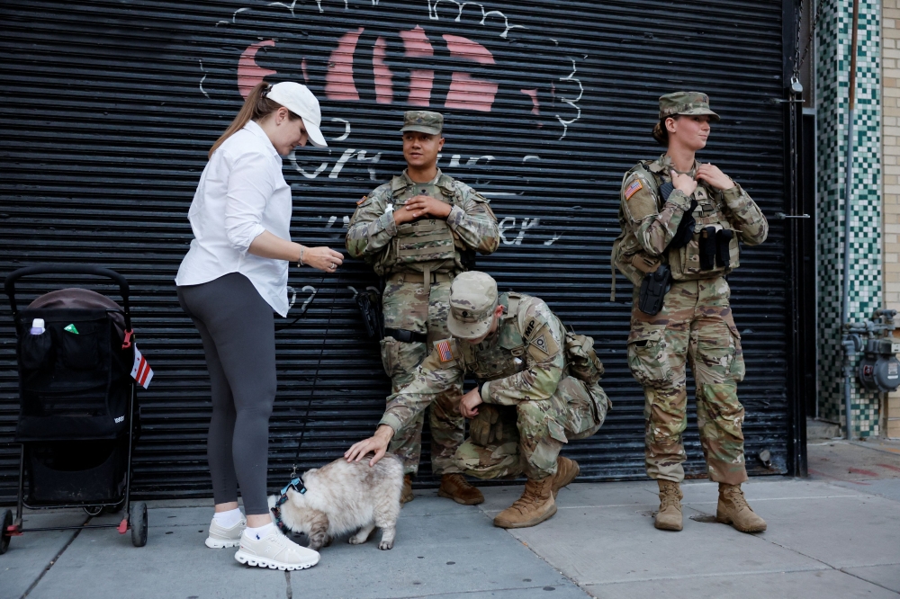Mulch, trash and patrols: US National Guard takes on unexpected duties in Washington amid controversy