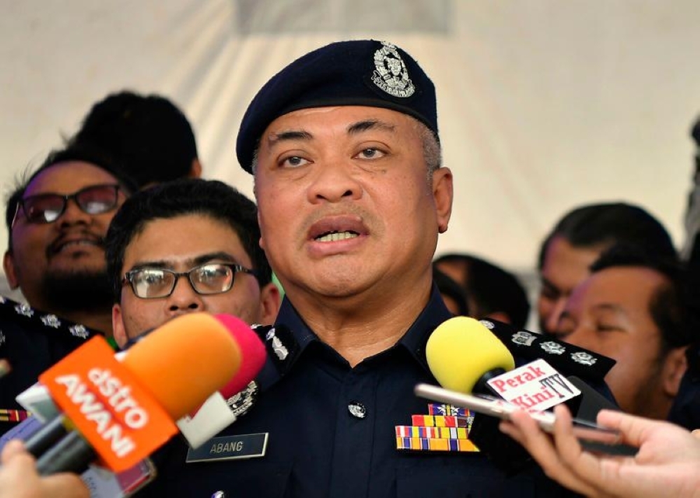 Ipoh police free nine as hunt for killer continues