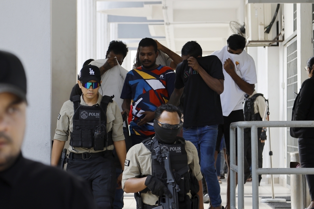 Thirteen face organised crime charges in Sepang court over ‘Geng Captain Praba’ links