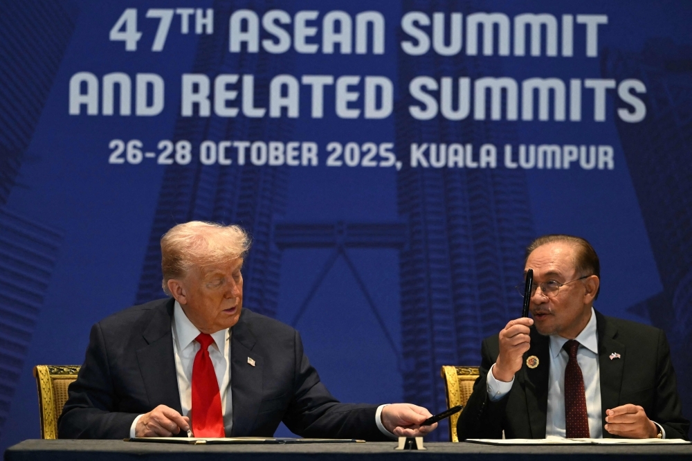 ‘Very different…very good…very artistic’: Trump praises Anwar’s signature, gifts White House pen at trade signing