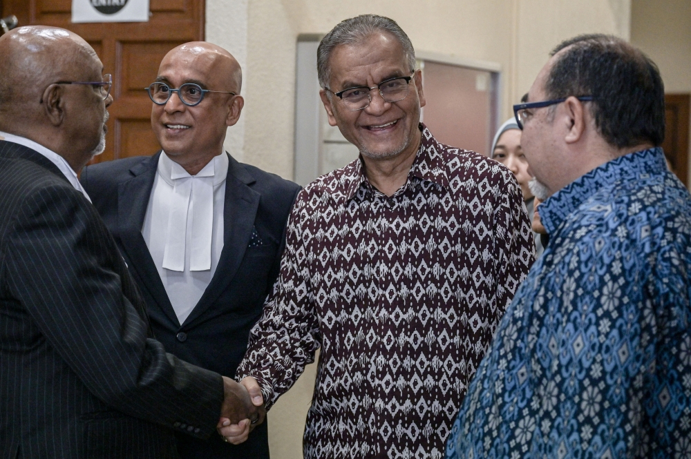 Dzulkefly says settlement includes Facebook clarification, removal of disputed post by Najib