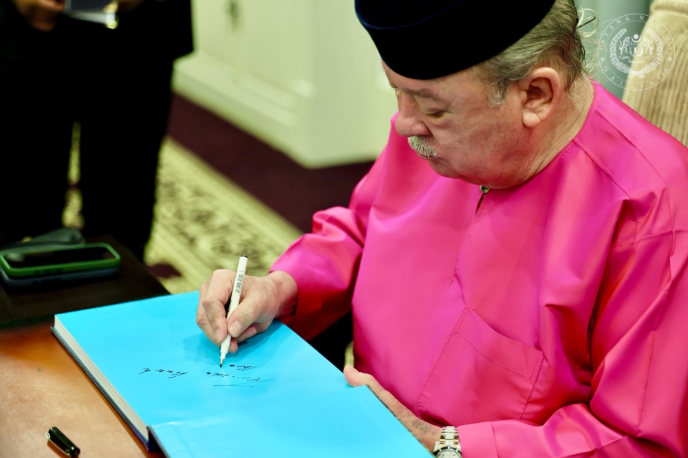 Sultan Ibrahim receives Bernama coffee table book documenting his journey as King