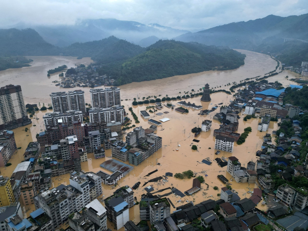 At least 10 dead as massive floods sweep China with more rain on the way