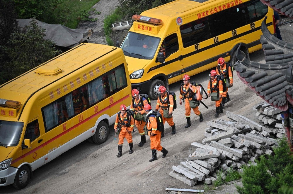 China rescuers search for two men still missing after mine blast kills 82
