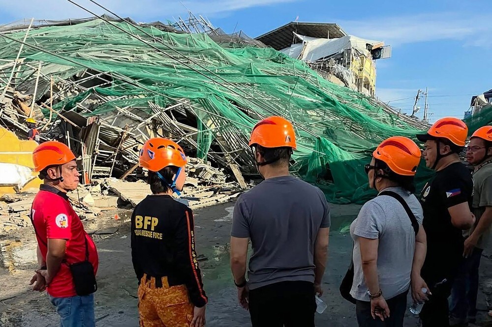 Two trapped people alive after Philippines building collapse, rescue continues