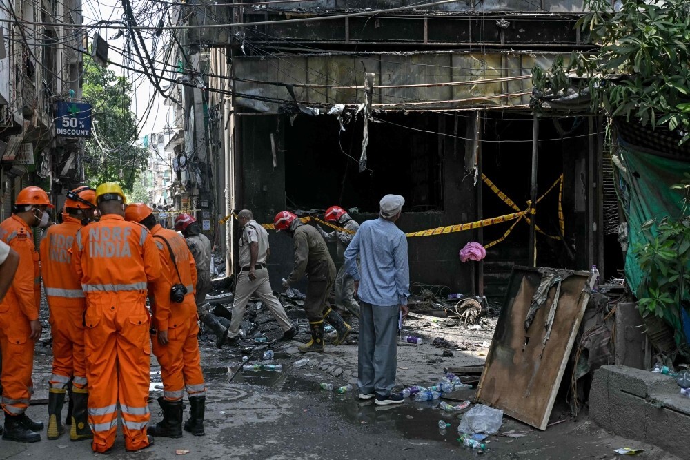 India detains hotel owner as probe begins into fire that left 21 dead amid scrutiny of safety standards